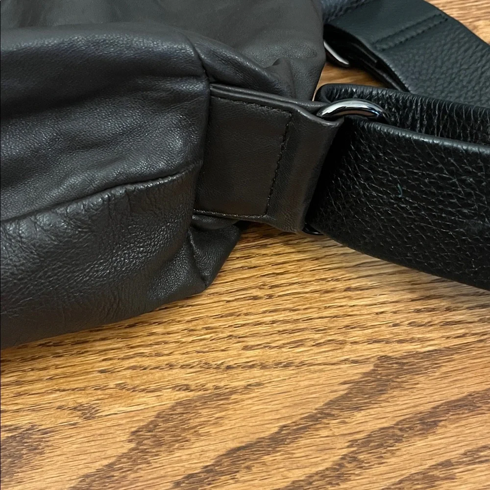 DanAzan slouchy one shoulder bag in brown leather with black adjustable strap